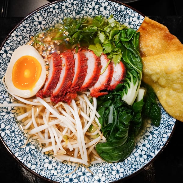 MISO Ramen with sliced pork, soft-boiled egg, bok choy, bean sprouts, and a crispy wonton.